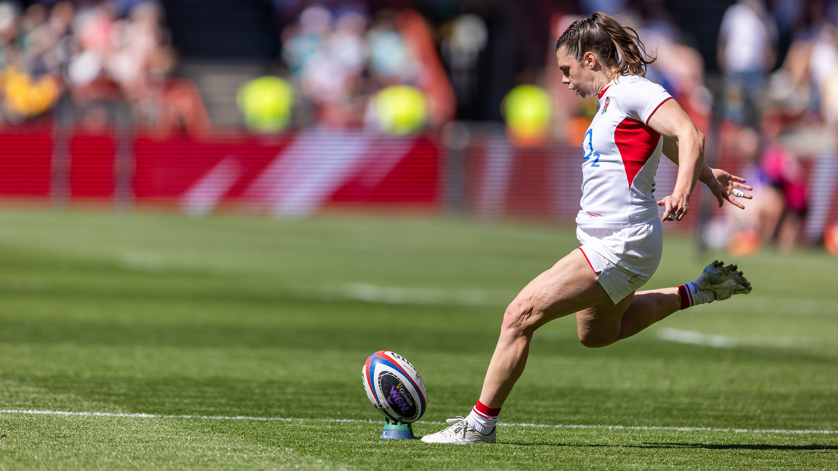 female rugby player kicking the ball during the women's six nations final 2026